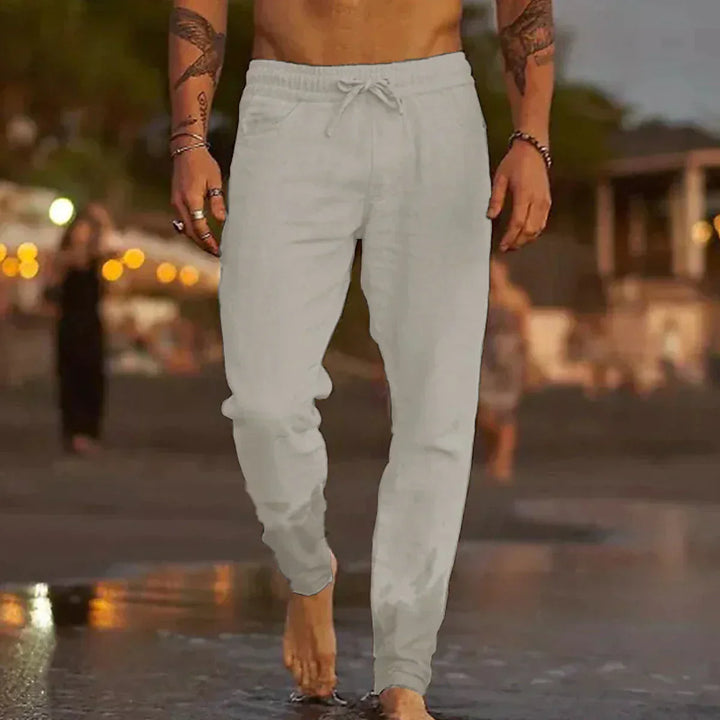 "Pantalon en lin léger pour hommes, coupe décontractée, disponible en beige, blanc, bleu, gris et noir, parfait pour l'été."