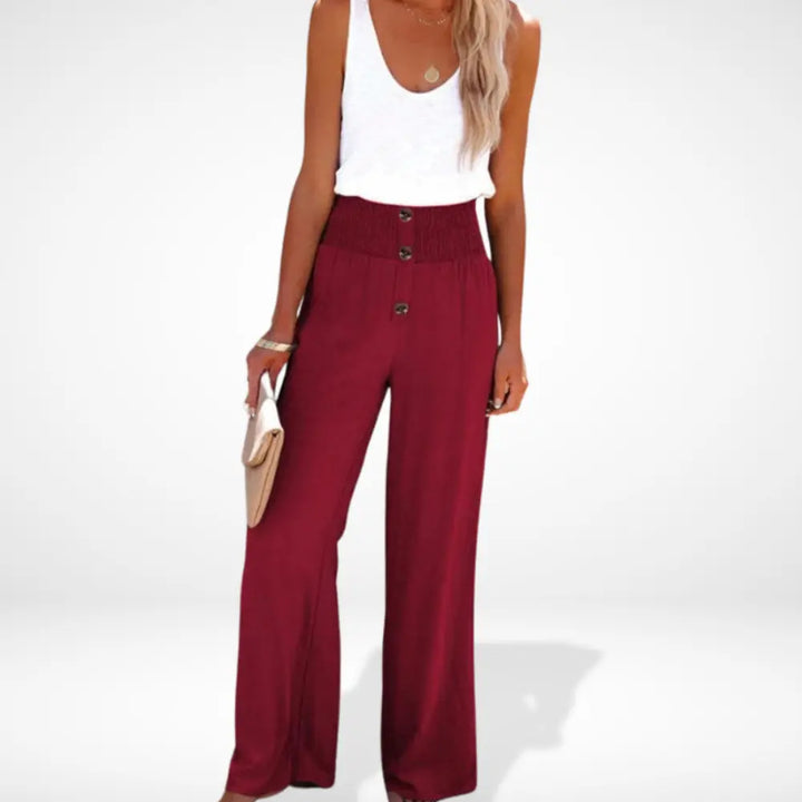 "Pantalon femme ample taille froncée, détails boutons, coupe fluide et élégante, style moderne et confortable."