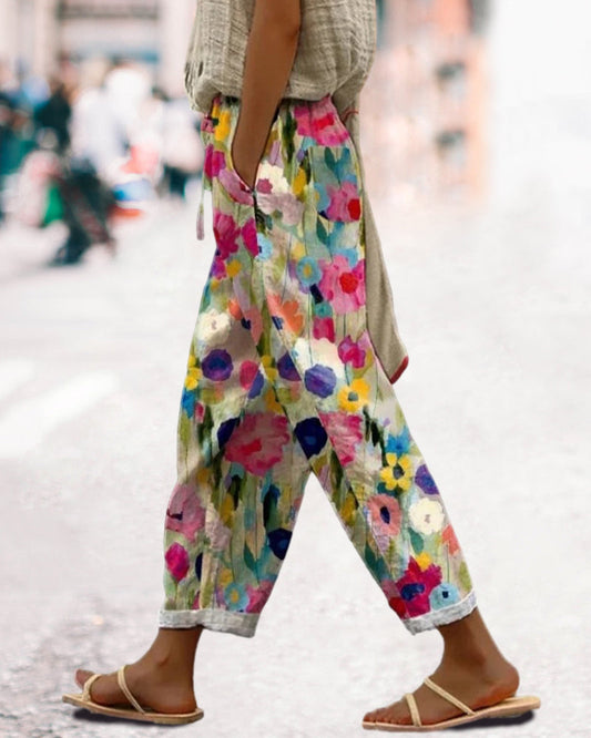 "Pantalon femme imprimé floral vif avec poches, style élégant et confort pour les saisons printemps-été."