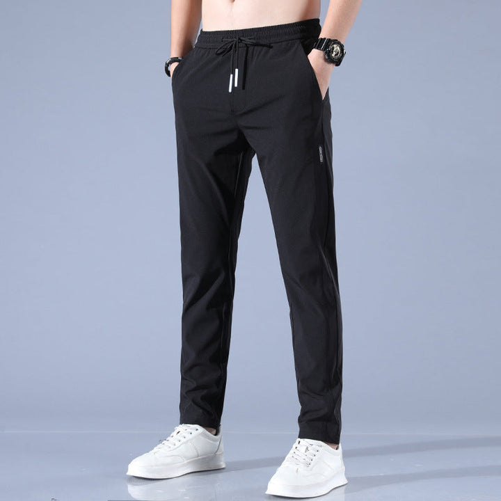 Pantalon homme élégant et confortable en tissu stretch gris, idéal pour le golf et sorties, coupe ergonomique.