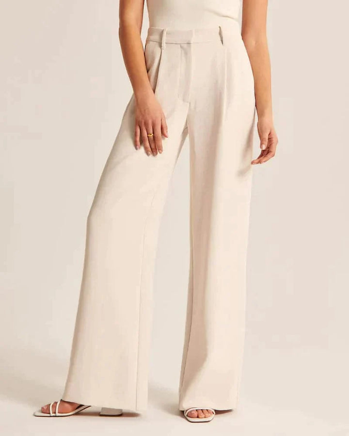 Pantalon large femme beige, taille haute, coupe élégante et confortable, allonge les jambes, idéal pour toutes occasions.