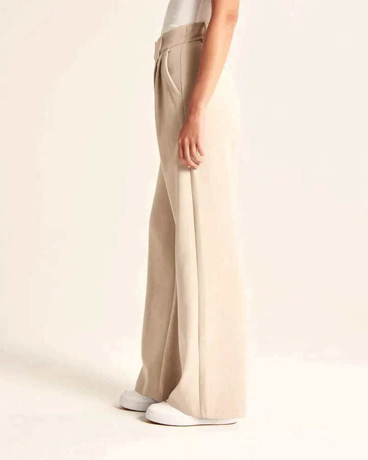 Pantalon large femme beige, taille haute, coupe élégante et confortable, allonge les jambes, idéal pour toutes occasions.