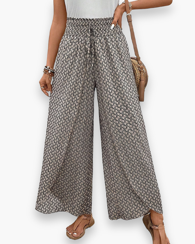 Pantalon large femme, coupe fluide, design graphique moderne, taille élastique, style chic et confortable, vue de face.