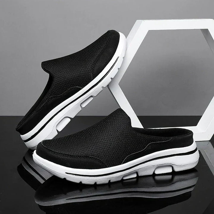 "Pantoufles homme luxueuses, respirantes et élégantes en coton mélangé, avec design ergonomique pour confort optimal."