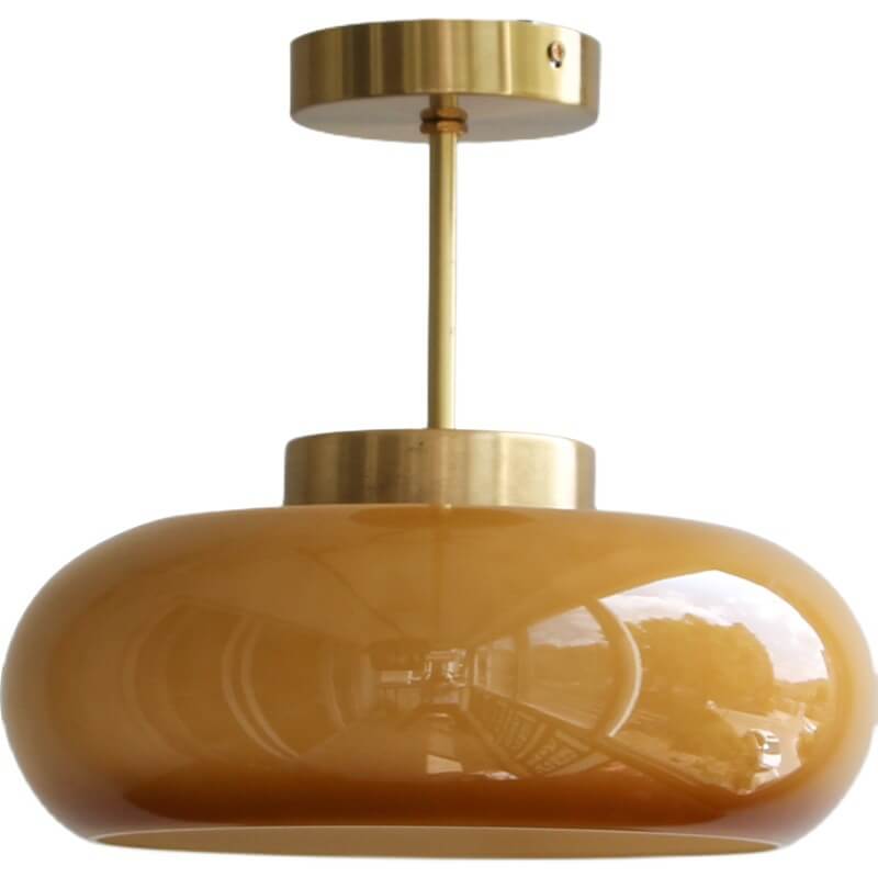 "Plafonnier vintage en laiton et verre jaune, design semi-flottant, éclairage doux, style rétro élégant pour intérieur."