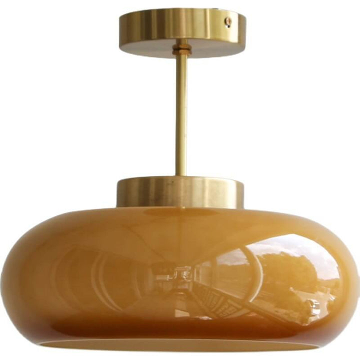 "Plafonnier vintage en laiton et verre jaune, design semi-flottant, éclairage doux, style rétro élégant pour intérieur."
