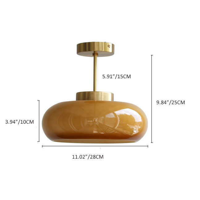 "Plafonnier vintage en laiton et verre jaune, design semi-flottant, éclairage doux, style rétro élégant pour intérieur."