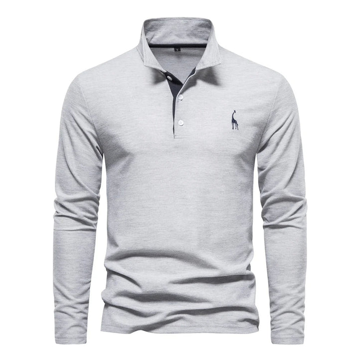"Polo homme élégant à manches longues, couleur unie, douce et respirante, avec broderie discrète de cerf pour un style raffin