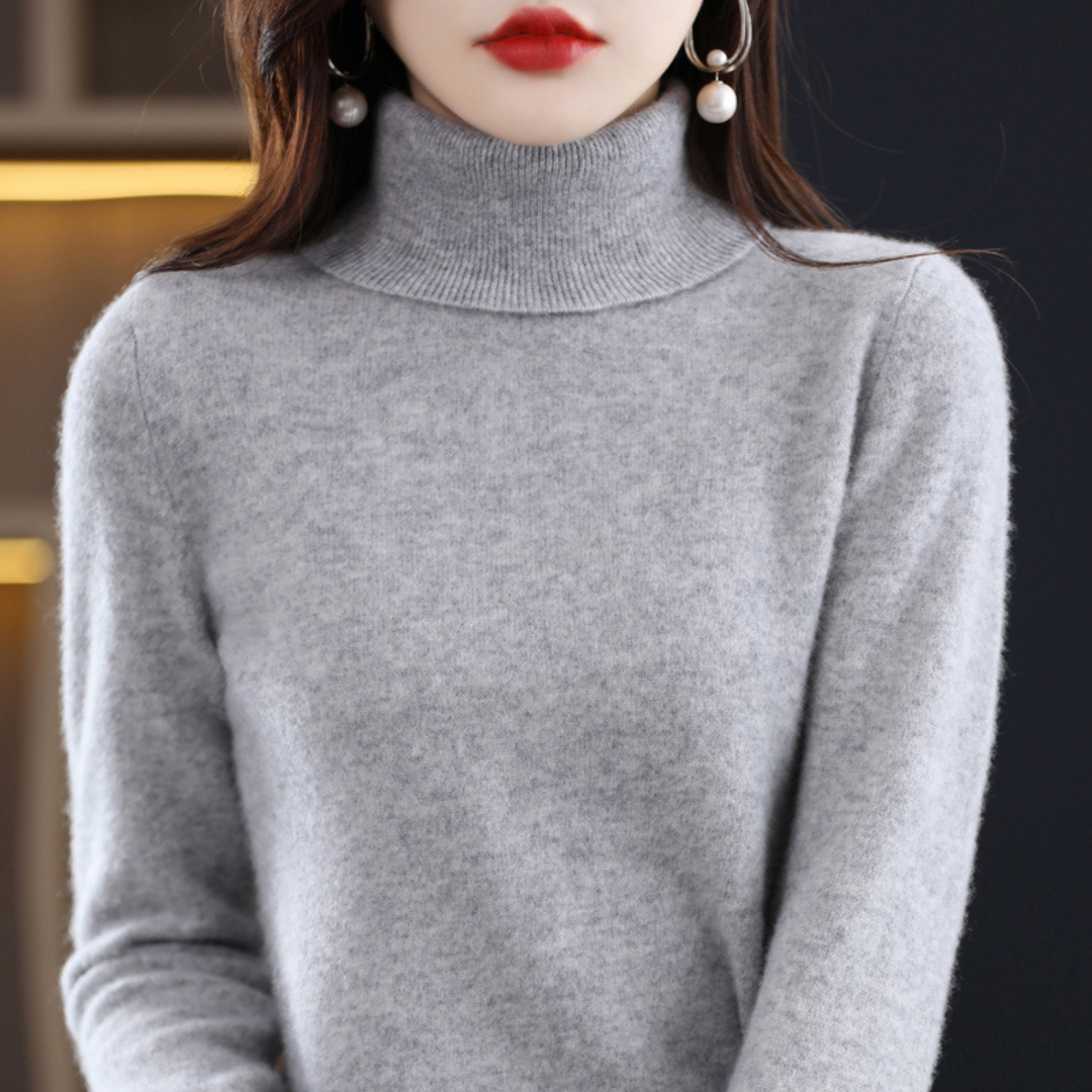 "Pull à col roulé en cachemire bleu pour femme, élégant et doux, ajout luxueux à toute tenue."
