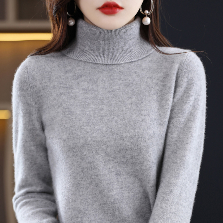 "Pull à col roulé en cachemire bleu pour femme, élégant et doux, ajout luxueux à toute tenue."