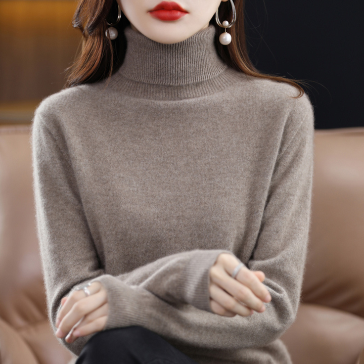 "Pull à col roulé en cachemire bleu pour femme, élégant et doux, ajout luxueux à toute tenue."