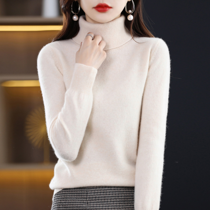 "Pull à col roulé en cachemire bleu pour femme, élégant et doux, ajout luxueux à toute tenue."