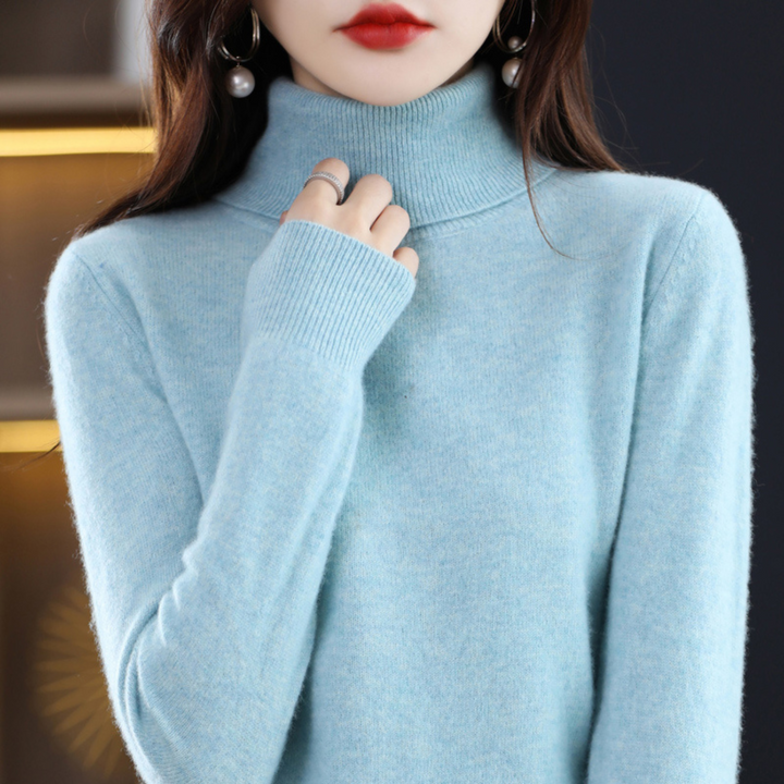 "Pull à col roulé en cachemire bleu pour femme, élégant et doux, ajout luxueux à toute tenue."