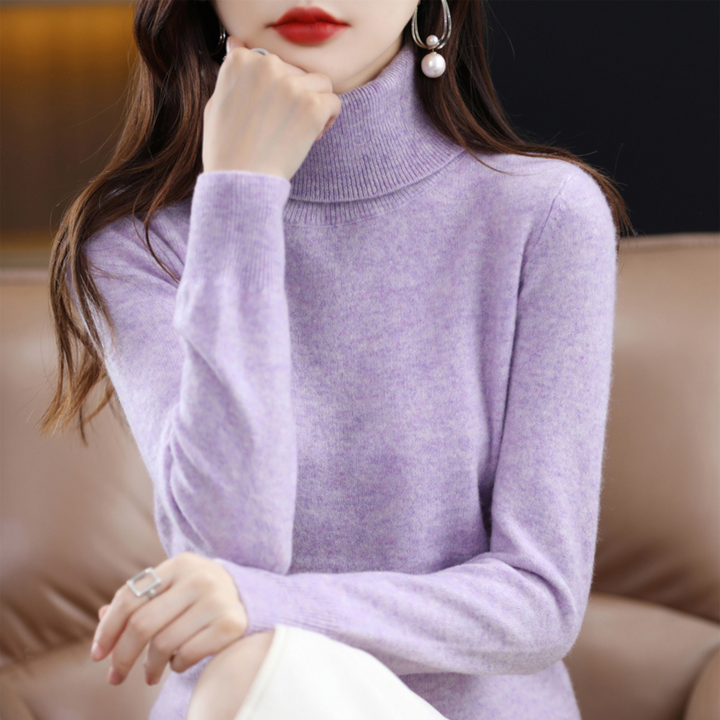 "Pull à col roulé en cachemire bleu pour femme, élégant et doux, ajout luxueux à toute tenue."