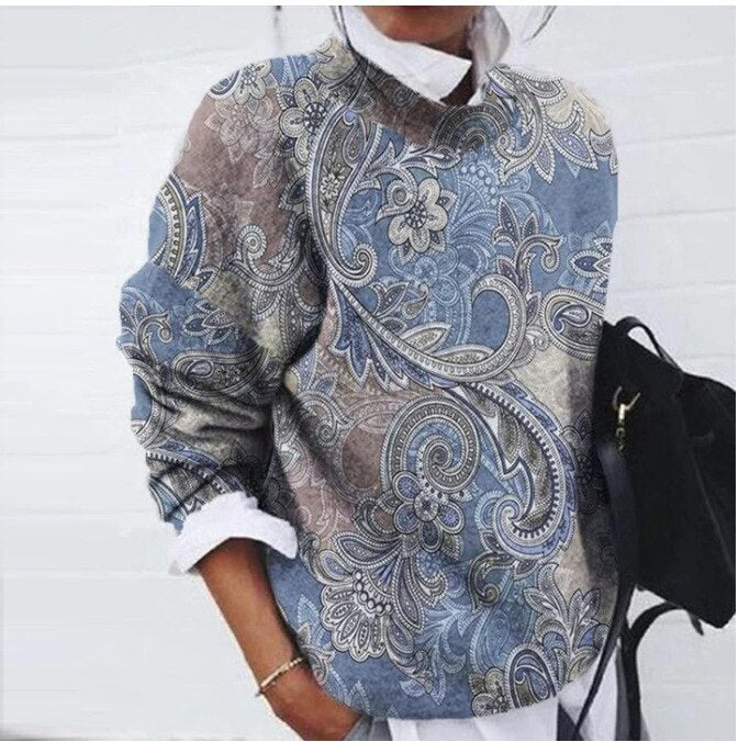 "Pull chic naturel avec motif floral délicat, coton mélangé, coupe flatteuse, idéal pour élégance quotidienne féminine."