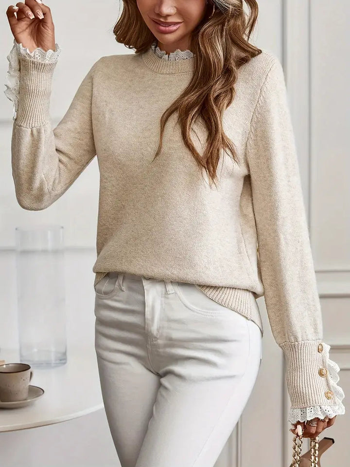 "Pull élégant femme, col rond, manches détaillées, moderne, chic et confortable, idéal travail ou sortie décontractée."