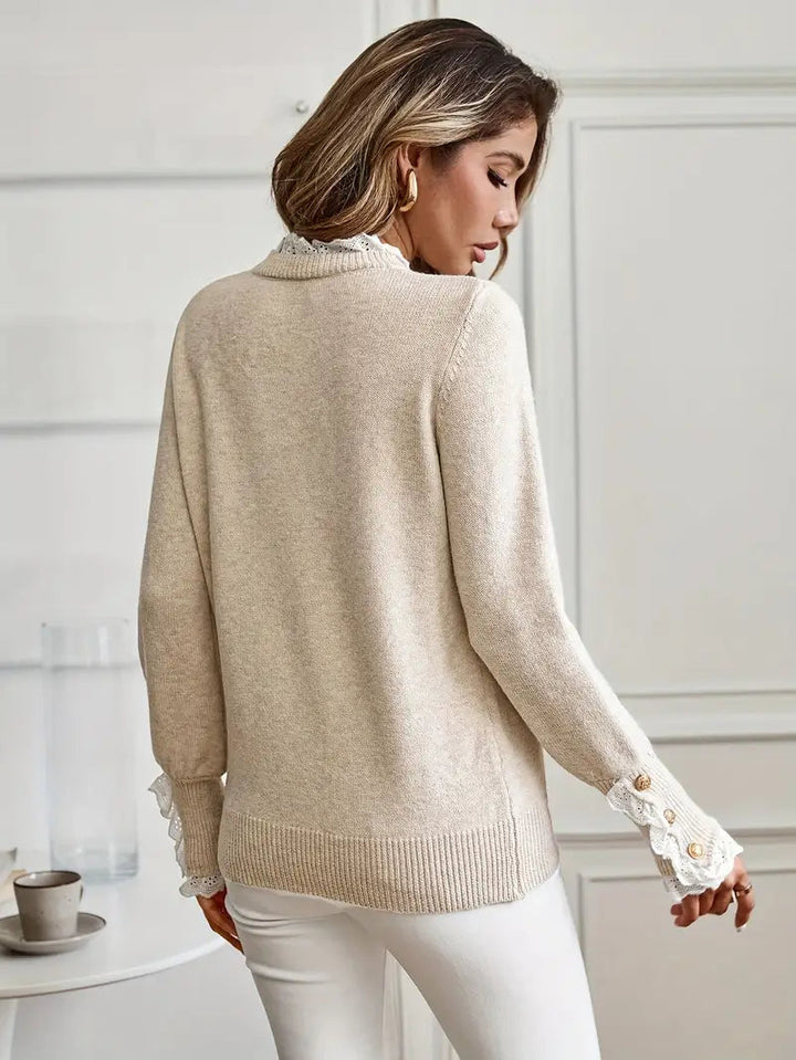 "Pull élégant femme, col rond, manches détaillées, moderne, chic et confortable, idéal travail ou sortie décontractée."