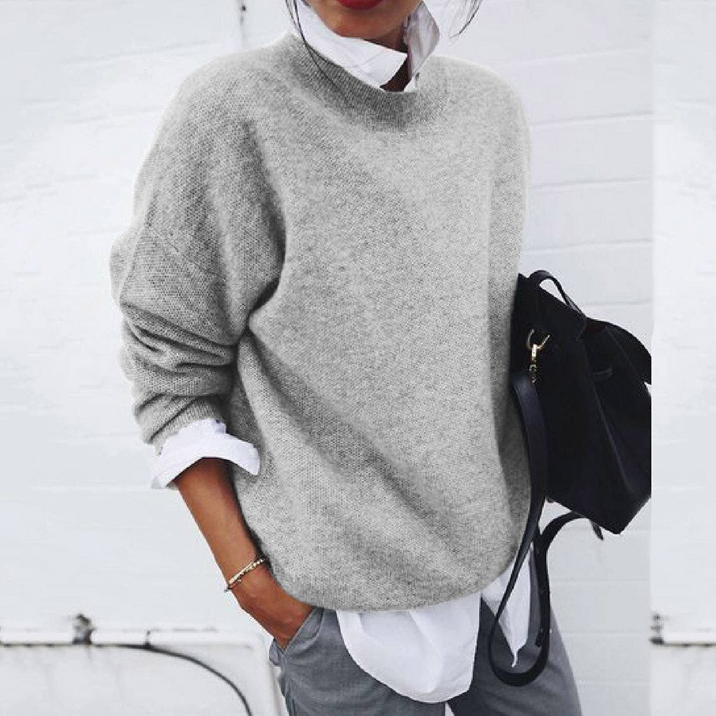 "Pull en cachemire doux pour femme, couleur neutre, design classique et élégant, tissu luxueux et confortable pour l'hiver."