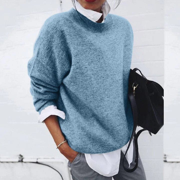 "Pull en cachemire doux pour femmes, style élégant, couleur rose, fond neutre sur cintre, idéal pour l'automne."
