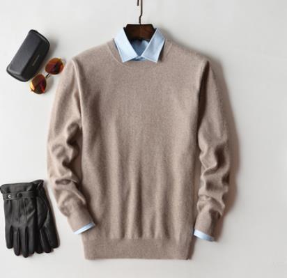 Pull en cachemire pour homme, couleur unie, texture douce, col rond, manches longues, élégance et confort haut de gamme.