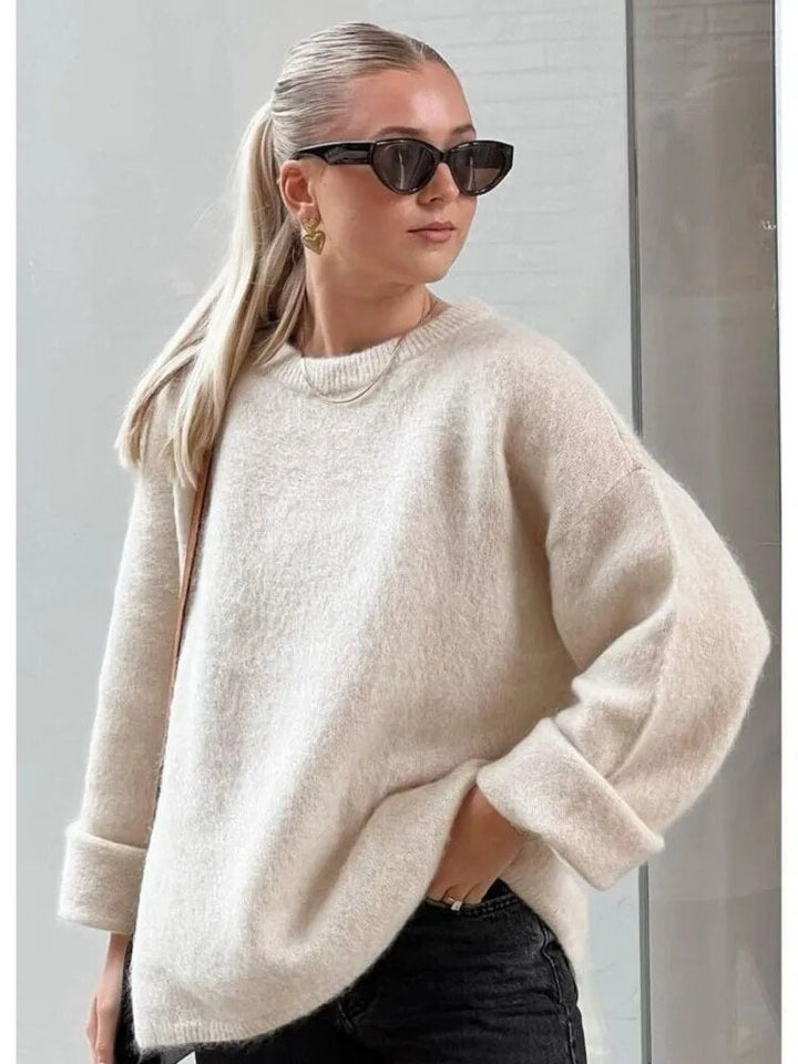 "Pull femme en laine douce, élégant, coupe ajustée, parfait pour toute saison, apportant confort et style intemporel."