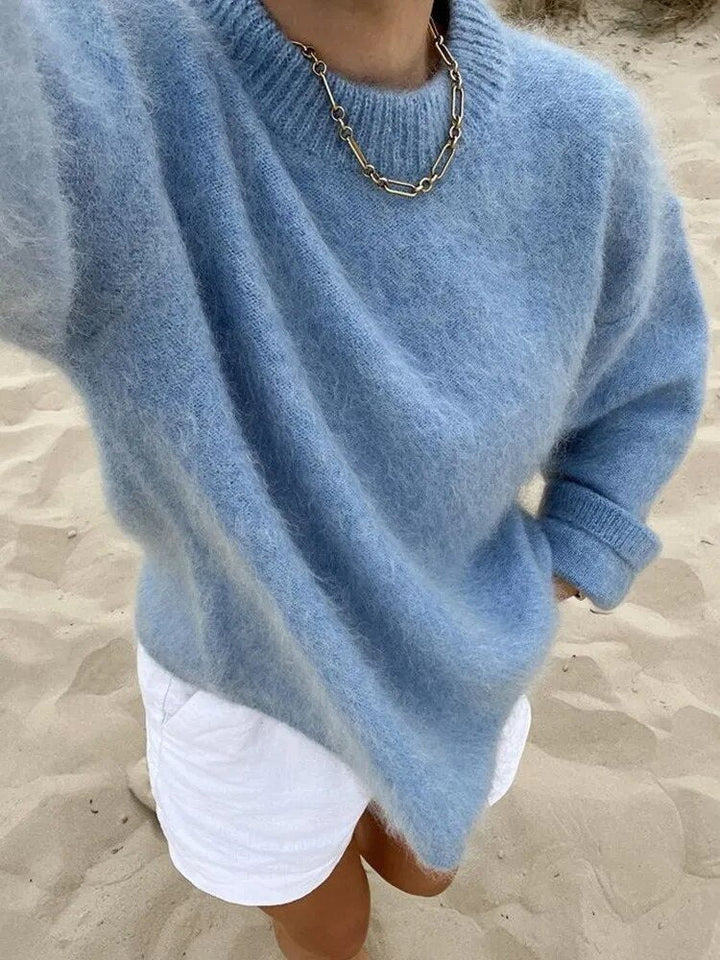 "Pull femme en laine douce, élégant, coupe ajustée, parfait pour toute saison, apportant confort et style intemporel."