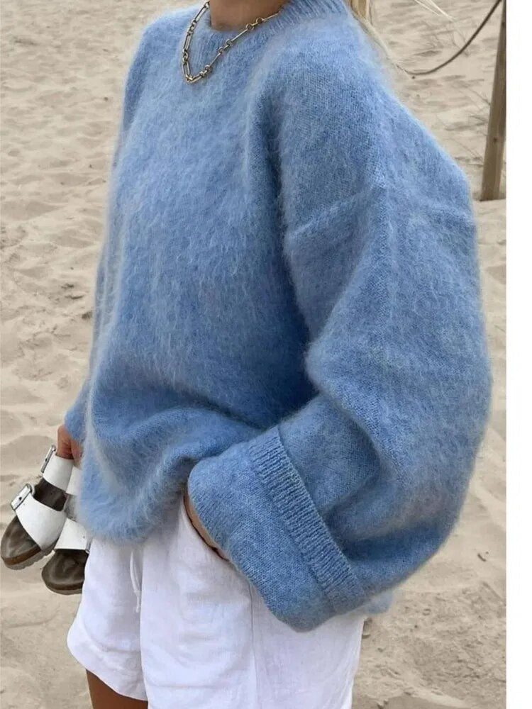 "Pull femme en laine douce, élégant, coupe ajustée, parfait pour toute saison, apportant confort et style intemporel."