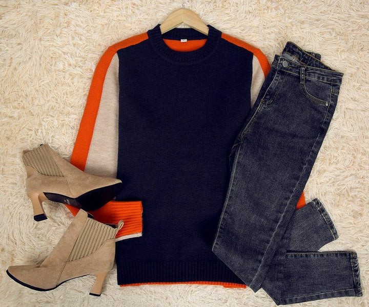 "Pull femme rayé marine et orange, design rétro color-block, coton doux, coupe classique et élégante."