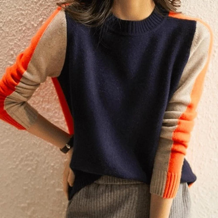 "Pull femme rayé marine et orange, design rétro color-block, coton doux, coupe classique et élégante."