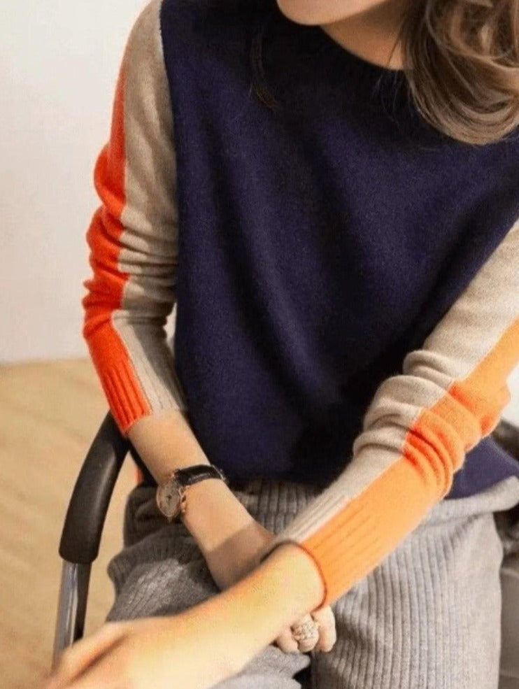 "Pull femme rayé marine et orange, design rétro color-block, coton doux, coupe classique et élégante."