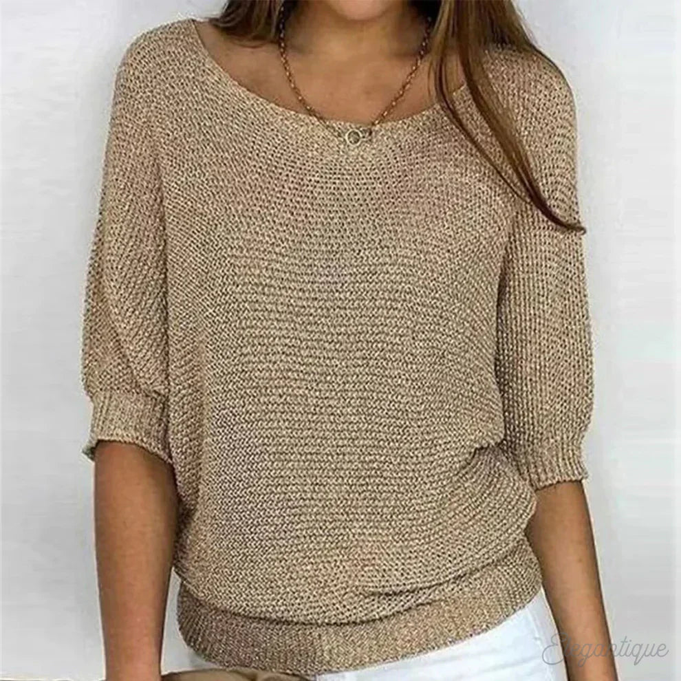 "Pull-over femme en maille croisée, élégant et confortable, texture douce, finitions délicates, style polyvalent."