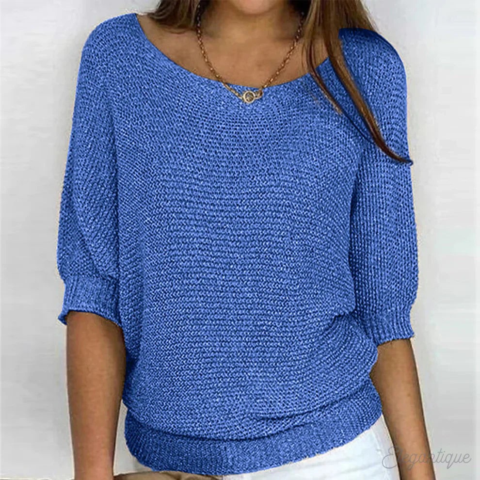 "Pull-over femme en maille croisée, élégant et confortable, texture douce, finitions délicates, style polyvalent."