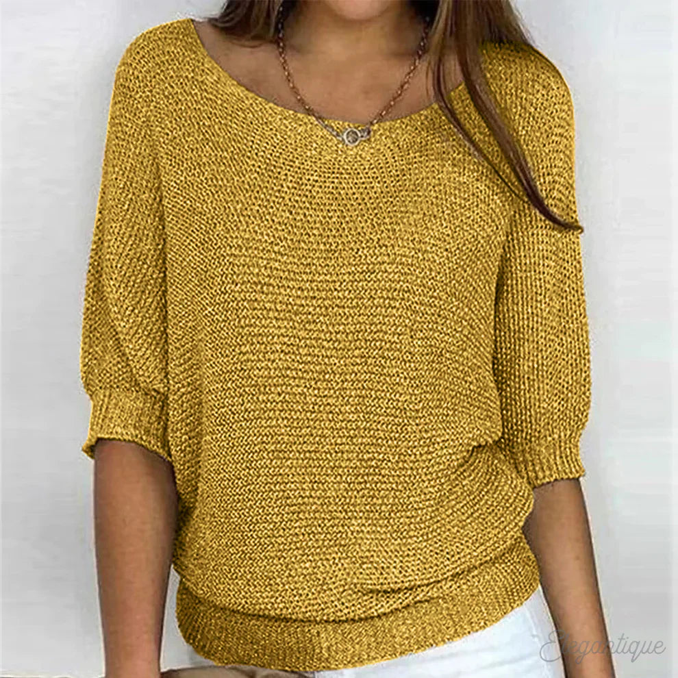 "Pull-over femme en maille croisée, élégant et confortable, texture douce, finitions délicates, style polyvalent."