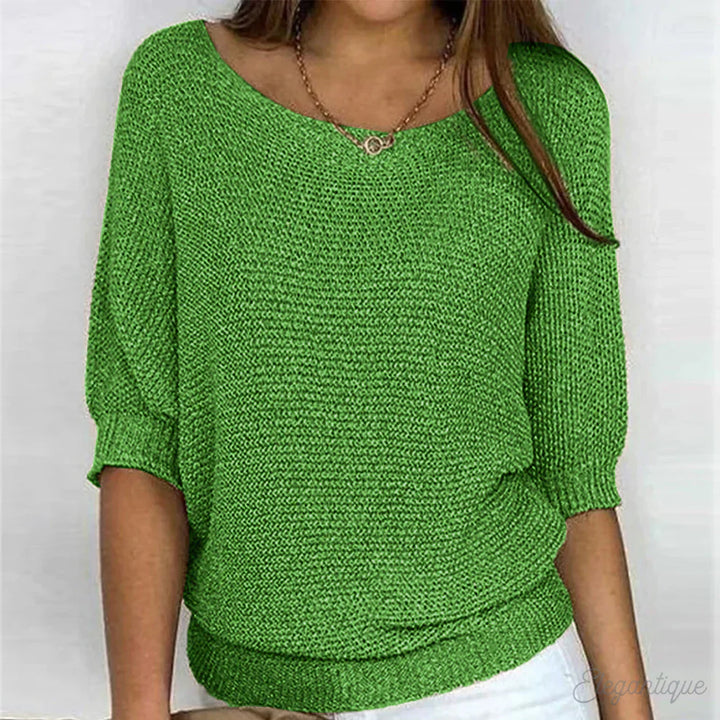 "Pull-over femme en maille croisée, élégant et confortable, texture douce, finitions délicates, style polyvalent."