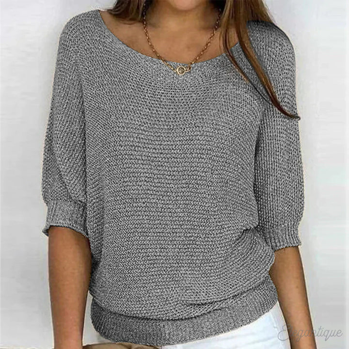 "Pull-over femme en maille croisée, élégant et confortable, texture douce, finitions délicates, style polyvalent."