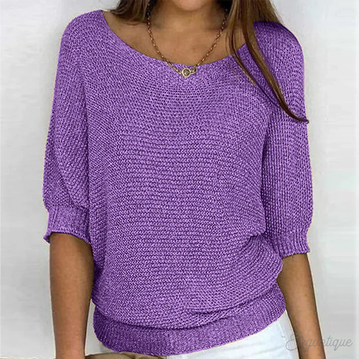 "Pull-over femme en maille croisée, élégant et confortable, texture douce, finitions délicates, style polyvalent."