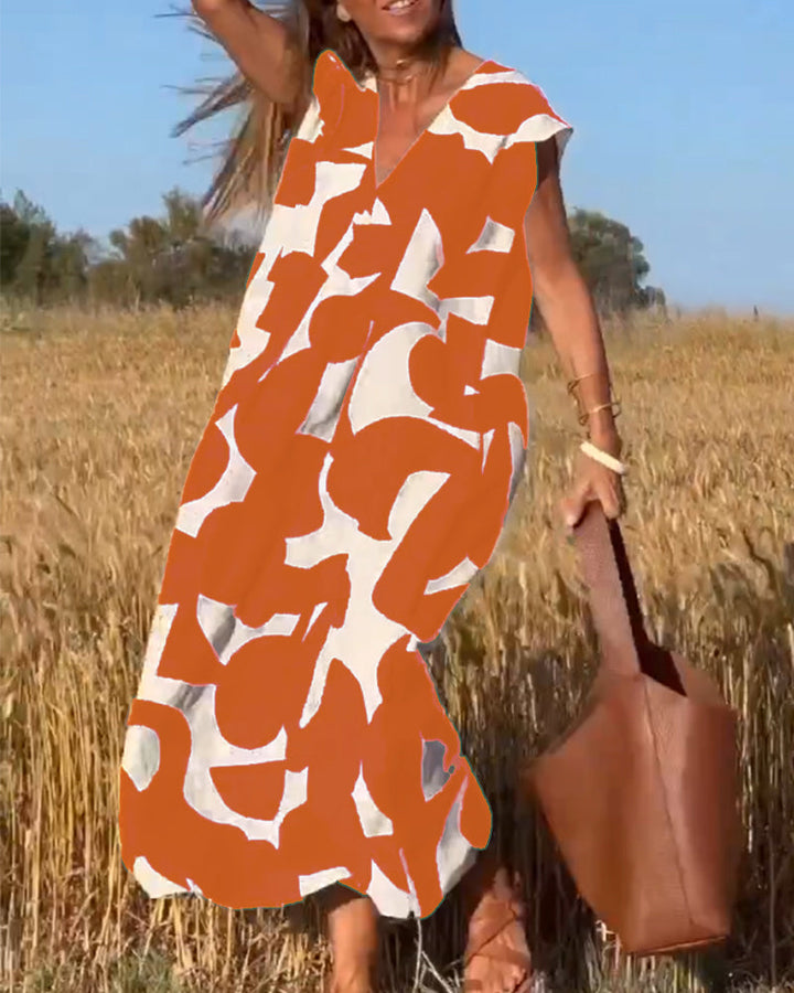 Robe Camille imprimé élégant col V, vue de face, robe féminine tendance pour femmes, tissu doux et respirant.