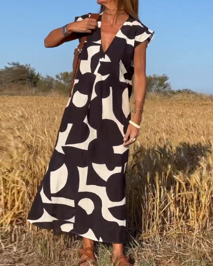 Robe Camille imprimé élégant col V, vue de face, robe féminine tendance pour femmes, tissu doux et respirant.