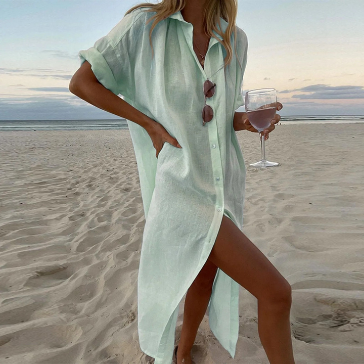 "Robe chemise élégante avec fentes hautes et boutons, tissu doux et durable pour confort et style moderne."