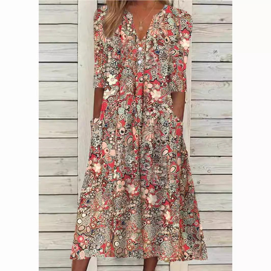 Robe chemise florale élégante Andrea, coupe flatteuse, fond blanc, fleurs colorées, polyvalente et confortable.