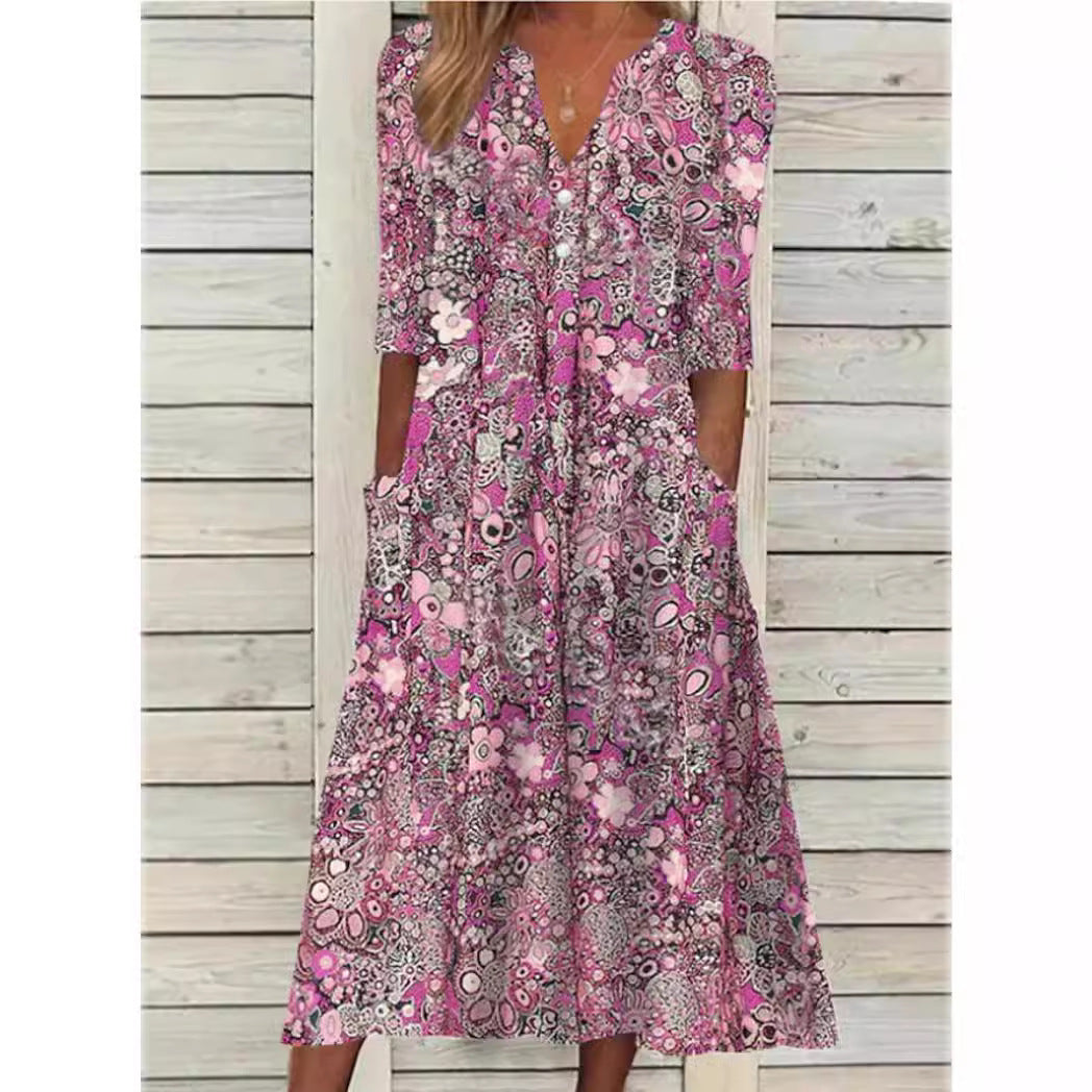 Robe chemise florale élégante Andrea, coupe flatteuse, fond blanc, fleurs colorées, polyvalente et confortable.