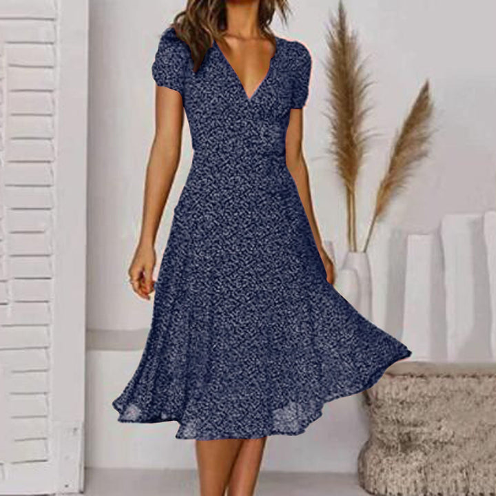 "Robe d'été A-line à imprimé floral vibrant, col en V flatteur, élégante et légère pour journées chaudes."