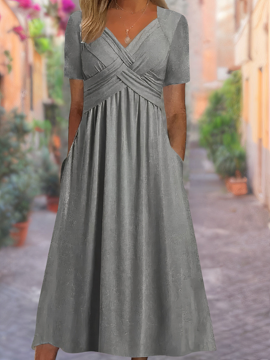 Robe d'été élégante légère avec col en V, coupe ample, tissu respirant; idéale pour sorties estivales ensoleillées.