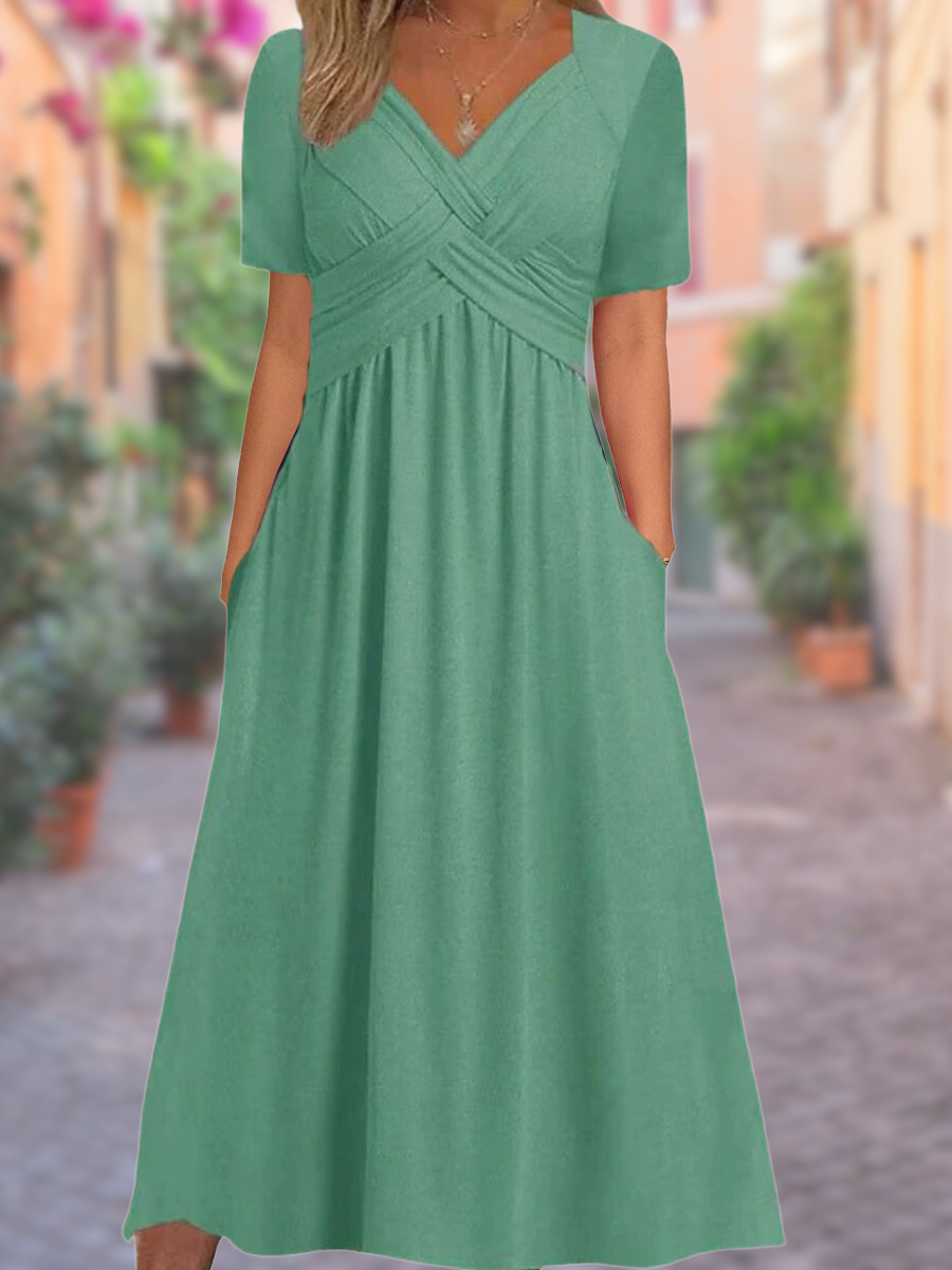 Robe d'été élégante légère avec col en V, coupe ample, tissu respirant; idéale pour sorties estivales ensoleillées.