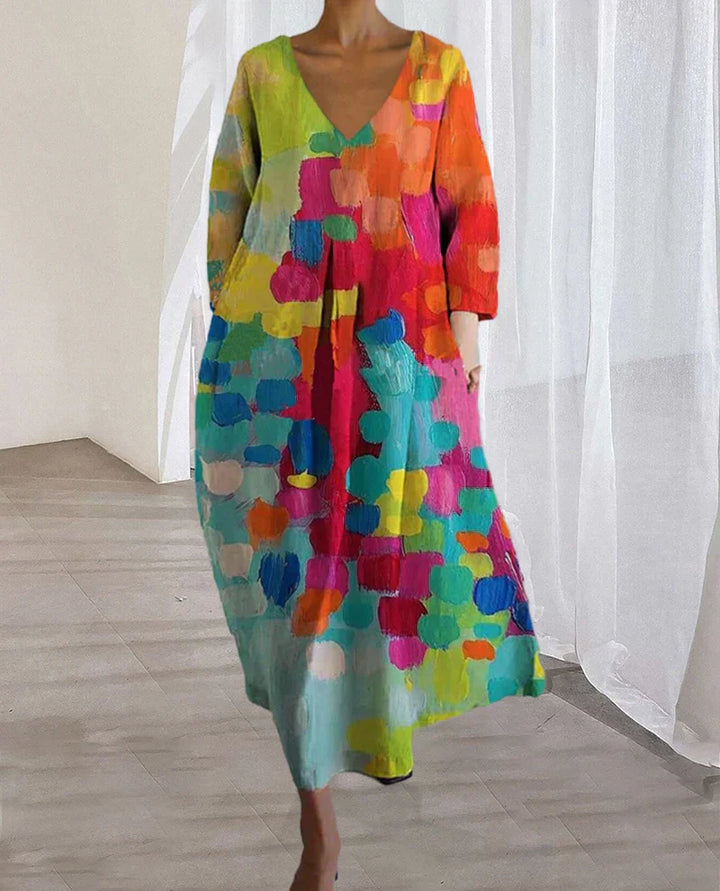 "Robe d'été en lin avec imprimé coloré, coupe flatteuse, idéale pour les sorties estivales."