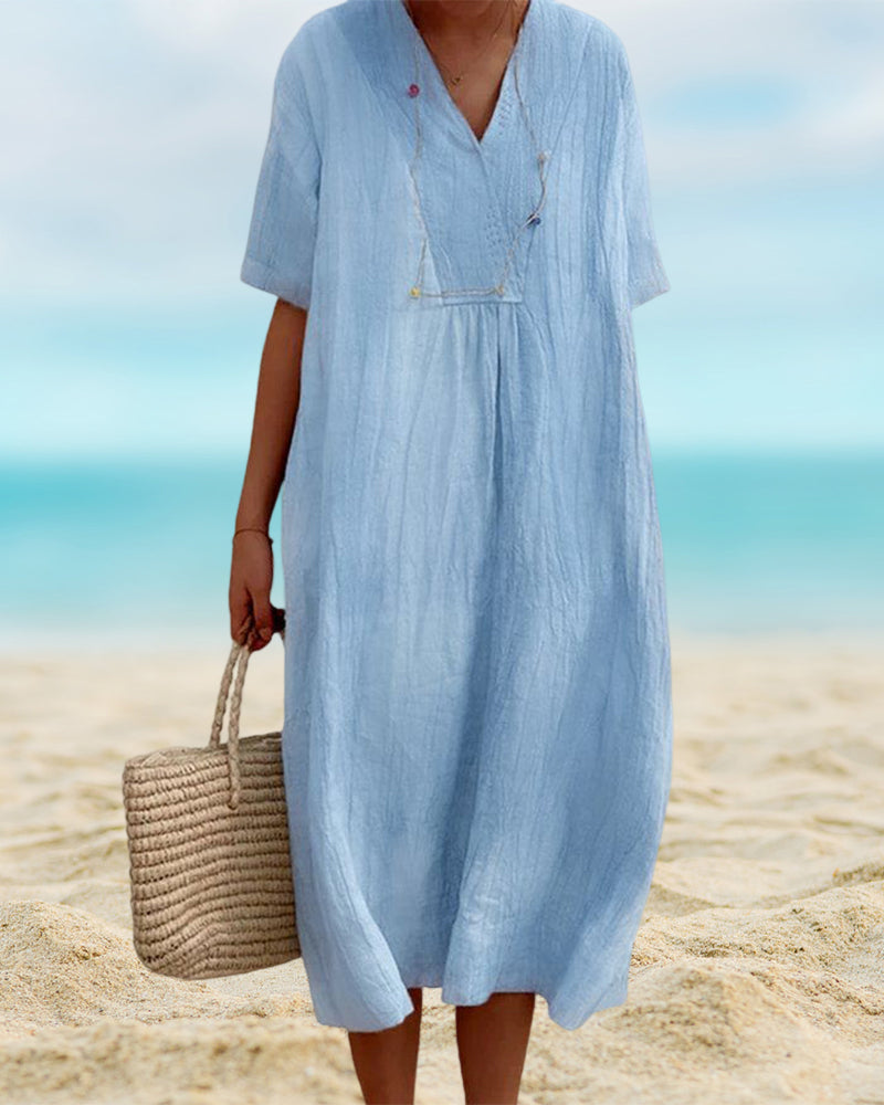 "Robe d'été fluide et élégante Johanna, en tissu léger, idéale pour un look féminin sous le soleil."