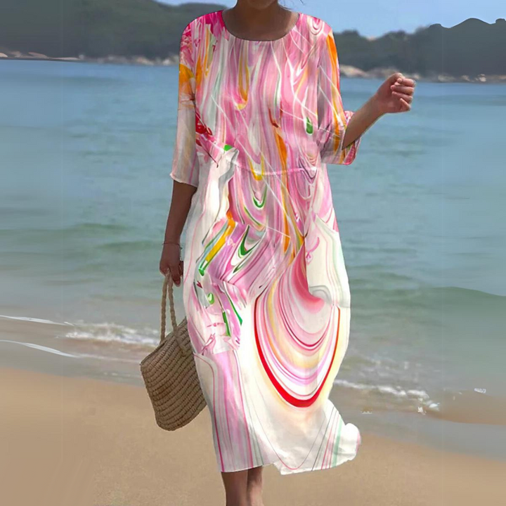 "Robe d'été midi fluide et élégante, idéale pour journées ensoleillées, en tissu léger offrant confort et style décontracté."