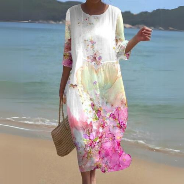 "Robe d'été midi fluide et élégante, idéale pour journées ensoleillées, en tissu léger offrant confort et style décontracté."