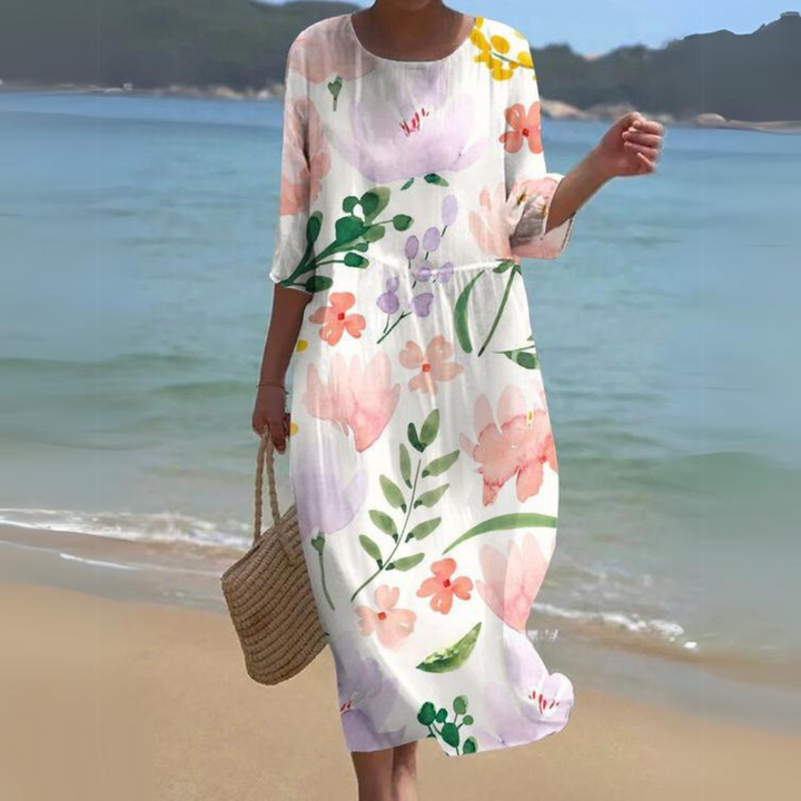 "Robe d'été midi fluide et élégante, idéale pour journées ensoleillées, en tissu léger offrant confort et style décontracté."
