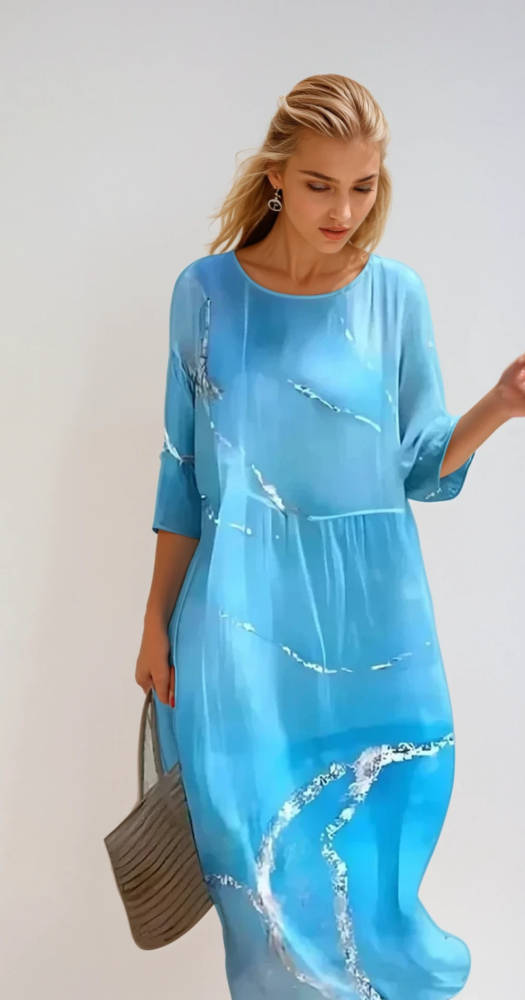 "Robe d'été midi fluide et élégante, idéale pour journées ensoleillées, en tissu léger offrant confort et style décontracté."